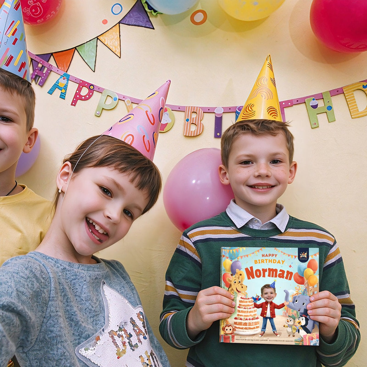 Smiling boy in a party hat holding his personalized Elfink Happy Birthday book with his name Norman and his own photo on the cover